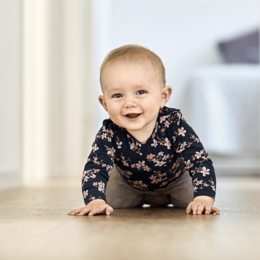 Infant crawling on the floor