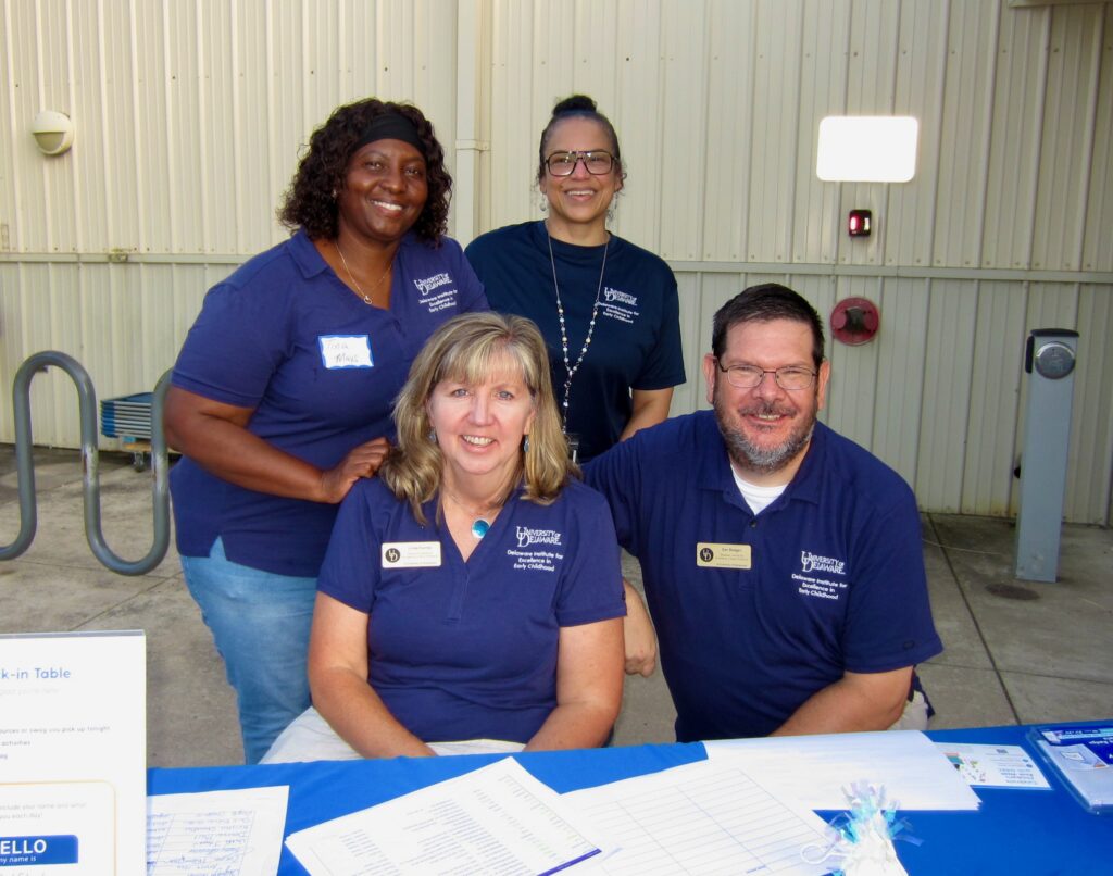 Pictured: DIEEC staff members gather at the community block party. Front row, L to R: Linda Farmer and Dan Regan. Back row, L to R: Tina Mays and Christian Ferrell. Photo by Courtney Foster, DIEEC.
