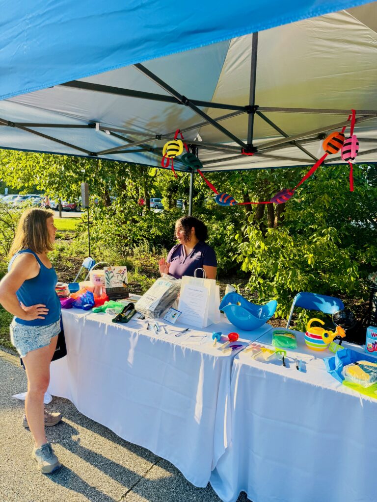 Pictured: DIEEC staff member Kimberly Cruz engages with an attendee during the evening’s festivities. Photo by Christian Ferrell, DIEEC.